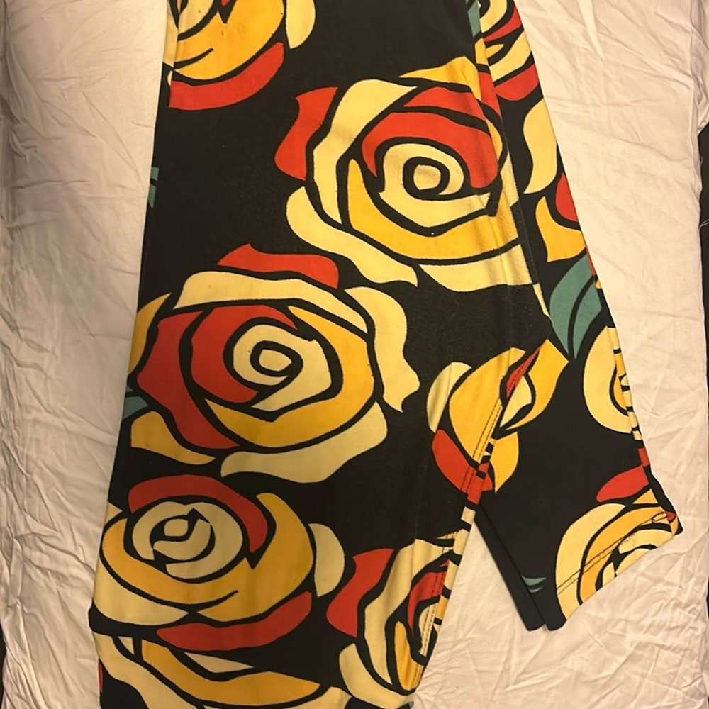 One size lularoe beauty and the beast rose leggings. Disney